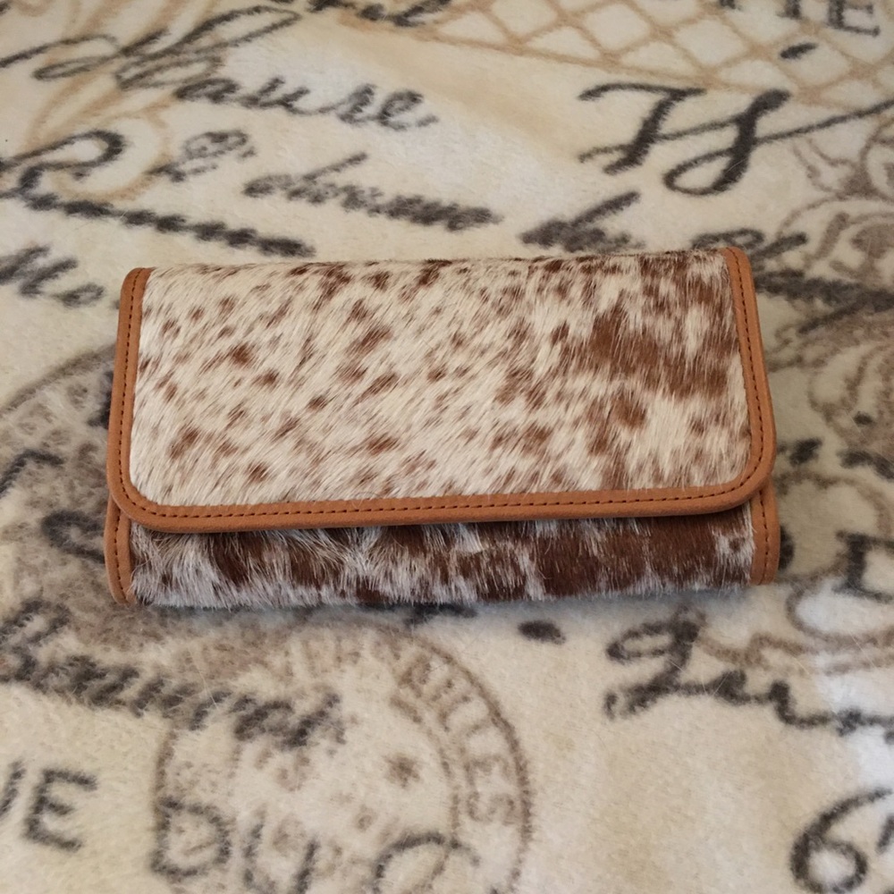 Tan and cream cowhide wallet